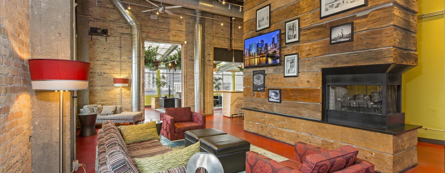 a spacious room with a fireplace