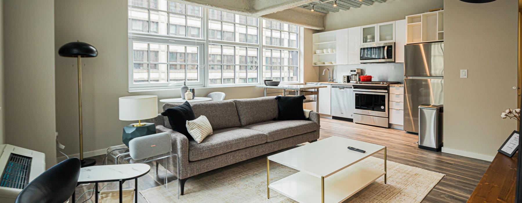 a living room with a couch and a table