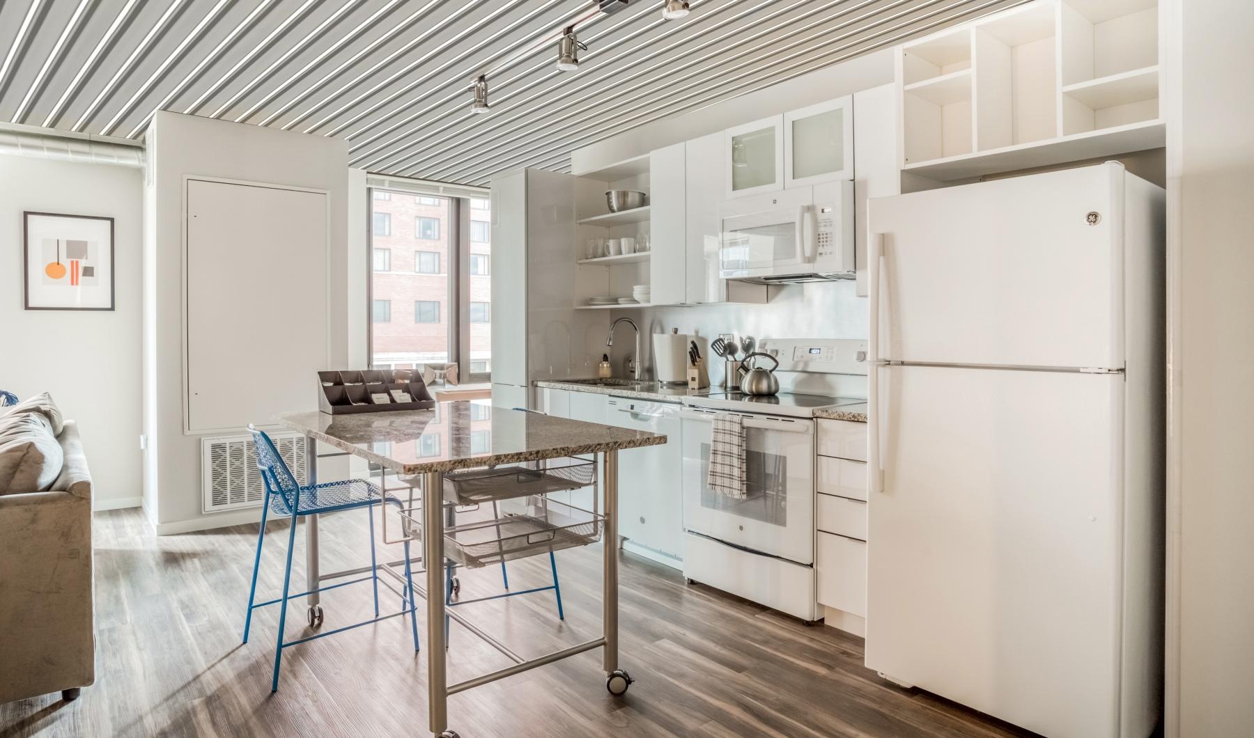 a kitchen with white cabinets